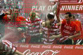 The champagne flows as Rovers celebrate promotion to the Championship at Wembley