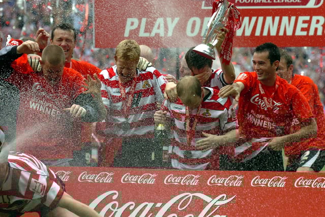 The champagne flows as Rovers celebrate promotion to the Championship at Wembley