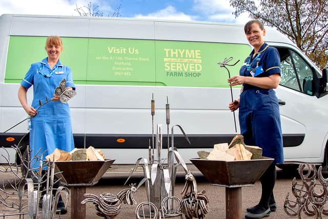 Staff Nurse Kariesha Brownless and Clinical Team Leader Sam Edwards, are pictured with the donated metalwork, alongside the van from Thyme Served, the prison’s own shop