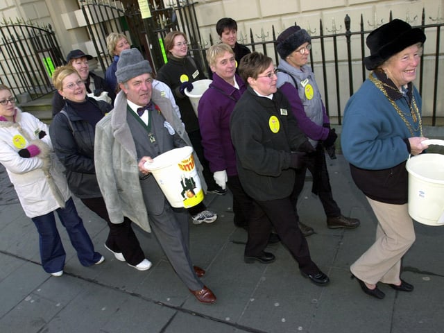 Staff from Carcroft's Asda store walked from Doncaster's Mansion House, around the town's market and then to their store in Carcroft, to raise money for Children in Need in 2001. The Mayor and Consort, Councillor Beryl Roberts (front), and her husband Joe Roberts joined them in the first stage of their walk round Doncaster market.