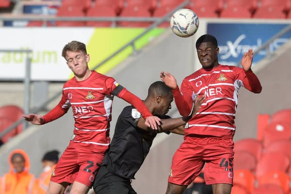 Mipo Odubeko and Ethan Galbraith challenge for the ball during the win against Crewe. Picture: Howard Roe/AHPIX LTD
