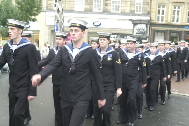 HMS Sheffieldm crew parading throught Fargate on their visit to the City today. Shoppers gave them a warm welcome applauding them on their way to a service at Sheffield Cathedral.