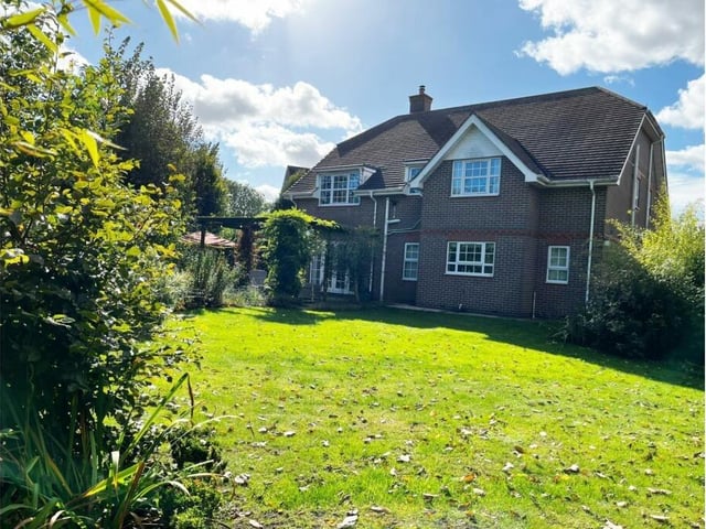 The rear of the house, with an extensive lawned and enclosed garden.