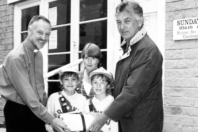 Pictured at the Sprotborough Methodist church, handing over a time capsule, left to right: The Reverend Dr Mike Hill, Sarah Wells 8, Marian Marsh Brownie Guide leader, Akison Davis 8, and Robert Guttridge architect, July 23, 1997
