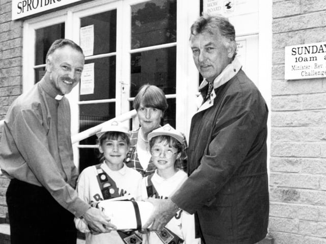 Pictured at the Sprotborough Methodist church, handing over a time capsule, left to right: The Reverend Dr Mike Hill, Sarah Wells 8, Marian Marsh Brownie Guide leader, Akison Davis 8, and Robert Guttridge architect, July 23, 1997