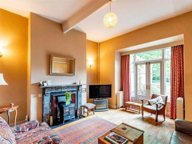 The snug adjoins the living room and has French doors out to the garden.