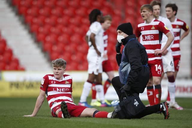 Scott Robertson receives treatment during the clash with Northampton. Picture: Ed Sykes/AHPIX