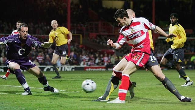 Michael McIndoe scores the opening goal during the Carling Cup Quarter Final between Doncaster Rovers and Arsenal. Photo: Ross Kinnaird/Getty Images