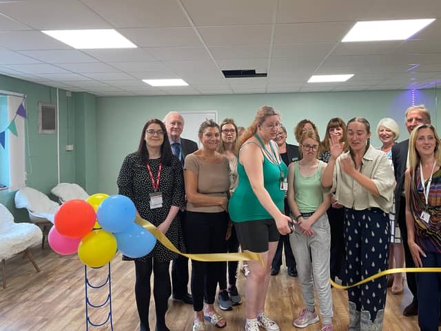 Dr Alan Billings (second from left) joins the celebrations as the new specialist wellbeing room at Doncaster Deaf Trust officially opens