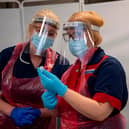 Nurses prepare the first doses of the Pfizer-BioNTech COVID-19 vaccine at the Northern General Hospital in Sheffield (Photo by ANDY STENNING/POOL/AFP via Getty Images)