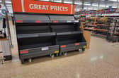 Empty fruit shelves.