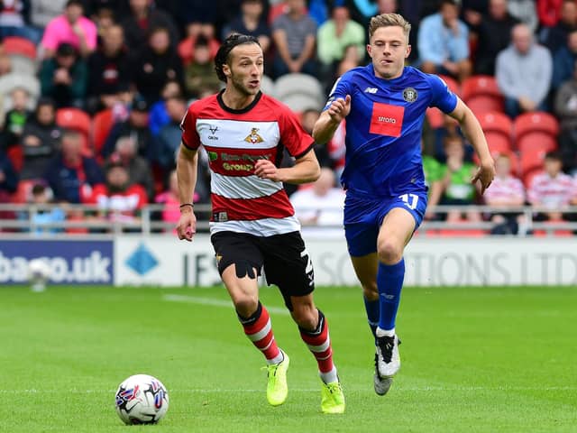 Doncaster Rovers' Jamie Sterry dribbles with the ball against Harrogate Town.