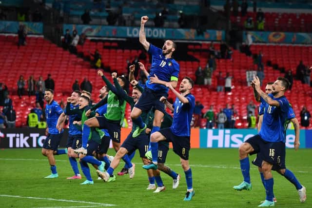 Italy celebrate their victory over Austria. Photo by Claudio Villa/Getty Images