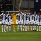 Hartlepool United's players observe a minute's silence as a mark of respect at Victoria Park earlier this season (photo: Mark Fletcher | MI News).