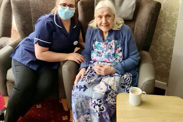 Maureen Townend with Deputy Manager of Flower Park Care Home, Danielle Savage. An 83-year-old care home resident has volunteered to work as a care assistant at her own home to help out staff. See SWNS story SWLEcarer. Maureen Townend expressed to staff at Flower Park Care Home in Doncaster, South Yorkshire, where she is a resident, how much she would like to be a care assistant. After haggling with carers, the care home finally allowed the caring OAP to work as a volunteer amongst her friends and other residents.