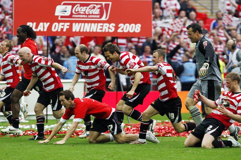 Doncaster Rovers' players enjoy the moment.