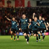 Crewe players celebrate their play-off win at the Eco-Power Stadium last May. (Photo by Ed Sykes/Getty Images)