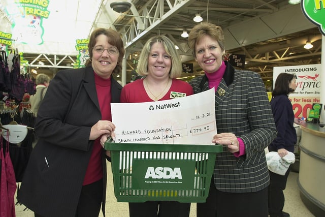 Doncaster Asda's customers services manager Linda Morris (left) and events co-ordinator Dawn Cunningham (centre) present Jennifer Batchelor-Wylam with a cheque for £74-90 for the Richard Foundation in 2001