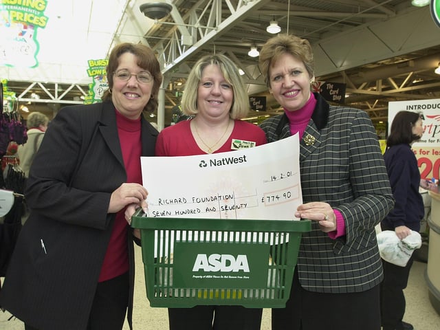 Doncaster Asda's customers services manager Linda Morris (left) and events co-ordinator Dawn Cunningham (centre) present Jennifer Batchelor-Wylam with a cheque for £74-90 for the Richard Foundation in 2001