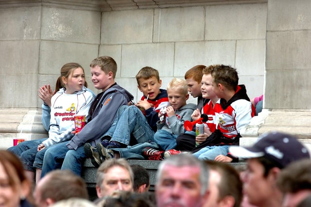 Young Rovers fans await the arrival of the team at the Mansion House.