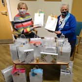 Jayne and Pauline handing over the packs at St John’s