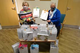 Jayne and Pauline handing over the packs at St John’s