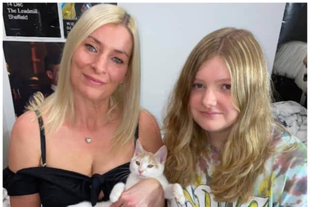 Cheryl and her daughter Zoe with Arthur the cat.