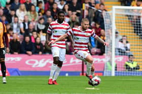 Doncaster's Adam Clayton takes charge of possession against Bradford. Photo: Howard Roe/AHPIX LTD.