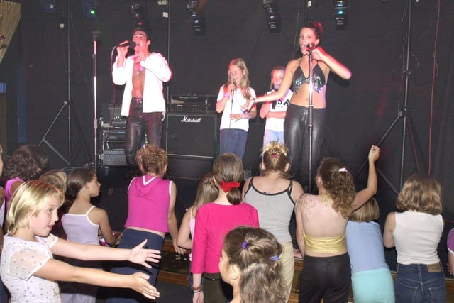Pictured at the Coronation Club, Stuart Street, Thurnscoe,  where Curt and Joanne of Barnsley group N'Chanted were performing for the Station House Community Association summer playscheme on August 22, 2001