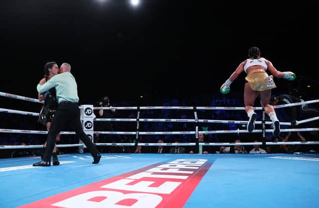 Referee Mark Lyson steps in to protect Terri Harper as Alycia Baumgarner celebrates winning the WBC and IBO super featherweight titles. Picture: Mark Robinson/Matchroom Boxing