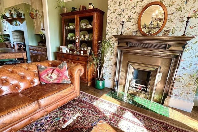 Another section of the living kitchen, with a feature fireplace.