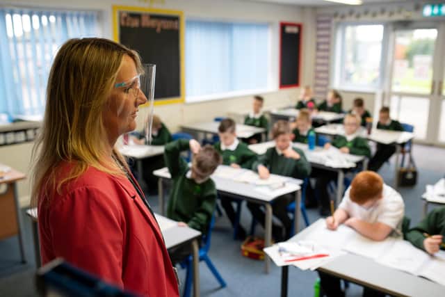 School Principal wearing a visor (Photo by OLI SCARFF / AFP) (Photo by OLI SCARFF/AFP via Getty Images)