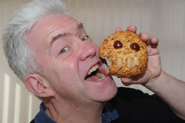 The Bard of Barnsley Ian McMillan tucks into a Fat Rascal.