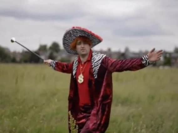 Matt Collins dressed as a pimp in his hilarious rap video
