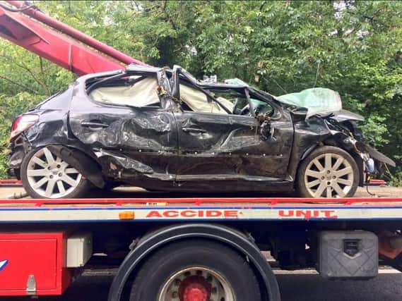 This was the shocking scene on Tickhill Road this morning, following a serious one-vehicle collision that led to a car ending up at the bottom of a road-side embankment. Picture: South Yorkshire Police