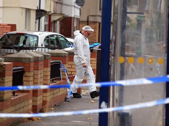 A crime scene investigation officer on the scene at The Avenue in Bentley. Picture: Chris Etchells