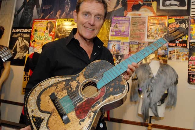 Alvin Stardust with the guitar signed by Buddy Holly.
