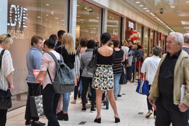 Massive queues snaked around the shopping centre with shoppers eager to be the first through the doors.