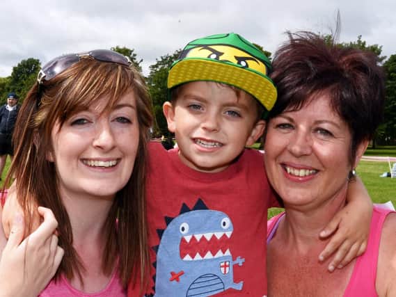 Ashleigh Andrew, 25, of Balby, spoke at this years event to help raise awareness of Cervical Cancer and urge women to attend their smear test. Ashleigh was diagnosed with Cervical Cancer last year after having her first Smear and has recently been given the all clear. She is pictured here with her mum Nicola Andrew and her son Bobbi Elliott, four.  Picture: Marie Caley NDFP RaceForLife MC 6
