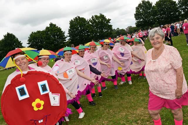 Front, Cherie Lambert and Mary Lambert (right), designed and made this Caterpillar costume for their friends and family members to wear to complete the Race for Life. Chloe Hull, Ellie Radley, Kirsty Radley, Antonia Turner, Louise Lambert, Helen Townsend and Harrison Turner, ten, also pictured.  Picture: Marie Caley NDFP RaceForLife MC 9