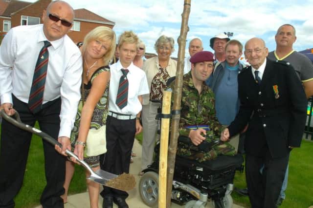 Dunscroft Community garden. Pictured at the opening of the Dunscroft Memorial garden are .... Harold Cockayne ,Ben Parkinson and Andrea and David Maughan who planted a tree in memory of their son Liam .