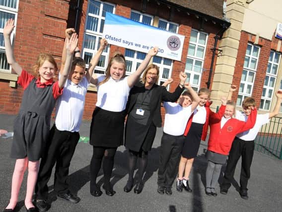 Staff and pupils at Edlington Victoria Primary are celebrating after a good Ofsted report. Headteacher Beryce Nixon is pictured with pupils. Now the school is set to take part in a new scheme to boost reading and writing