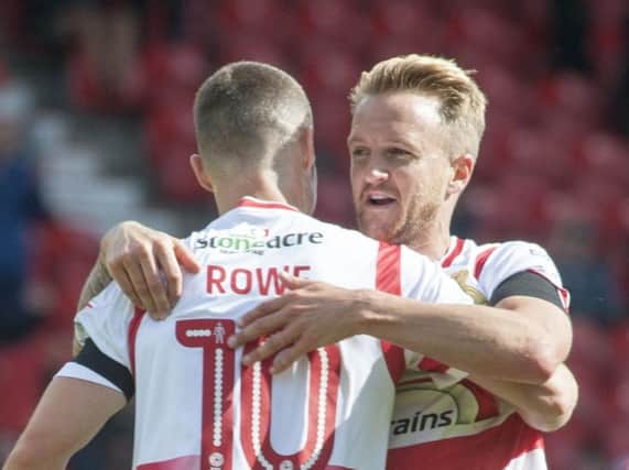 James Coppinger congratulates Tommy Rowe for his part in Rovers' opening goal. Picture: Dean Atkins