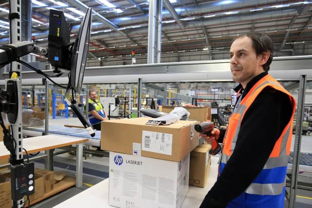 A tour of the Amazon base at Doncaster iPort as the Christmas rush begins to start. Items arrive at the warehouse and are sorted and stacked ready for picking when a order arrives. Pictured is Jason Straw. Picture: Chris Etchells