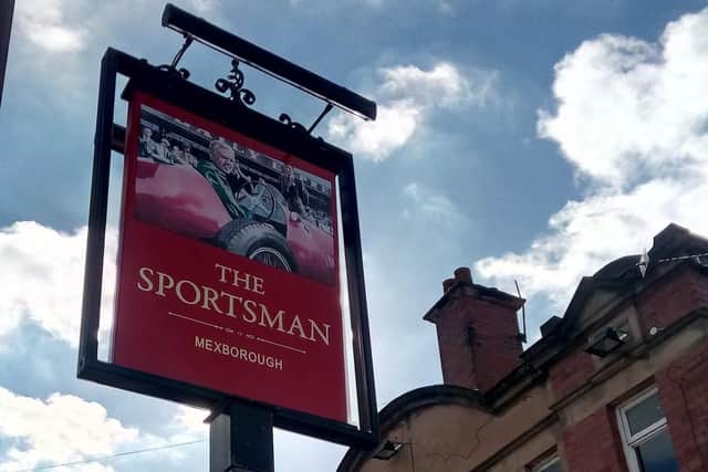 The sign at the former Sportsman pub in Mexborough, depicting Mike Hawthorn in his Ferrari.