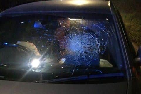 The Audi's windscreen was left smashed by the impact.