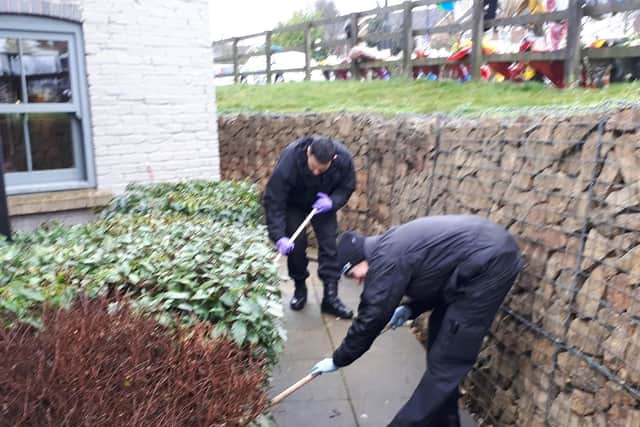 Police officers searched the land outside a Doncaster pub where a man was shot dead