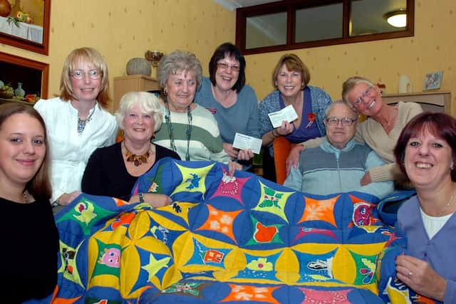 Fundraisers with cheques totalling just over a 1,000 for St John's Hospice, Balby.