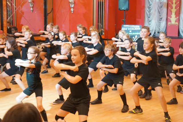 Children from Norton Junior School perform the Haka for the New Zealand rugby league team in 2013.