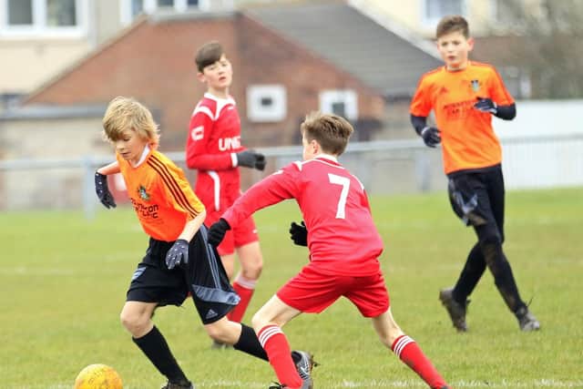 Aston Dunstan, in action for Doncaster U13s against Barnsley.